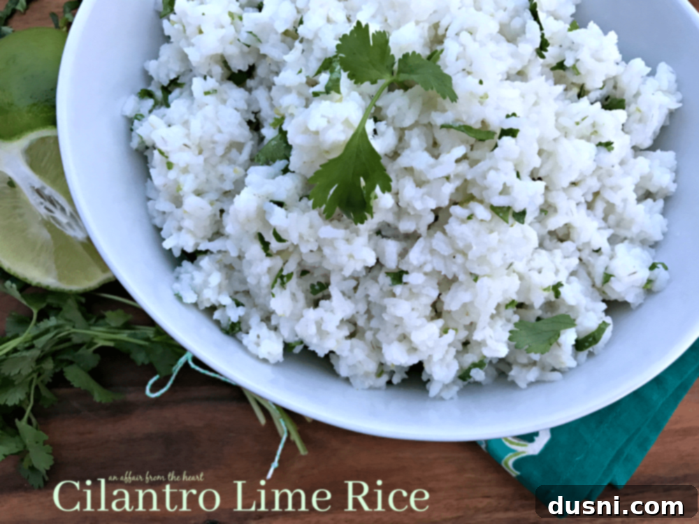 Bowl of Cilantro Lime Rice garnished with fresh cilantro and a lime slice