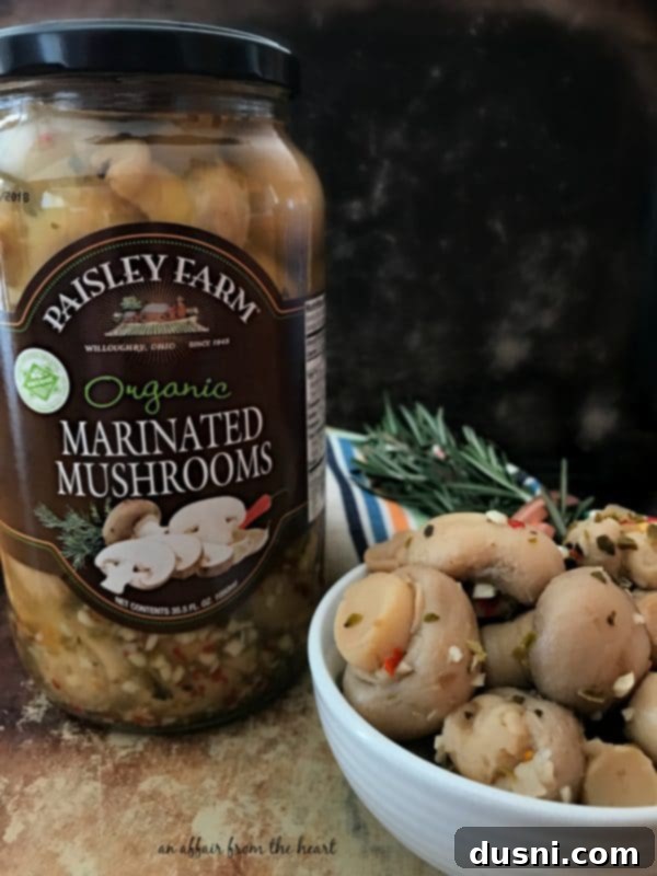 A serving of Chicken, Mushroom & Wild Rice Soup in a bowl, ready to be enjoyed.