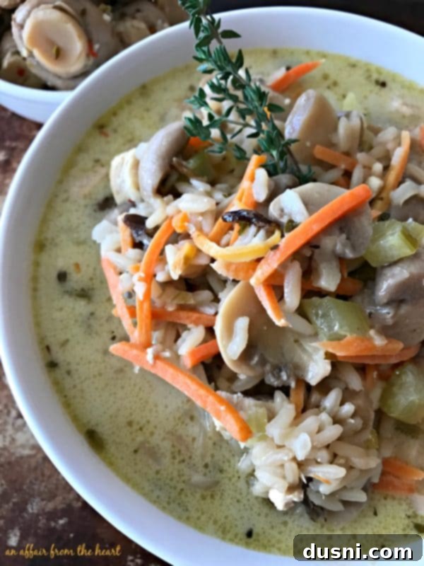 Diced chicken and vegetables sautéing in a stock pot, forming the base of the delicious soup.
