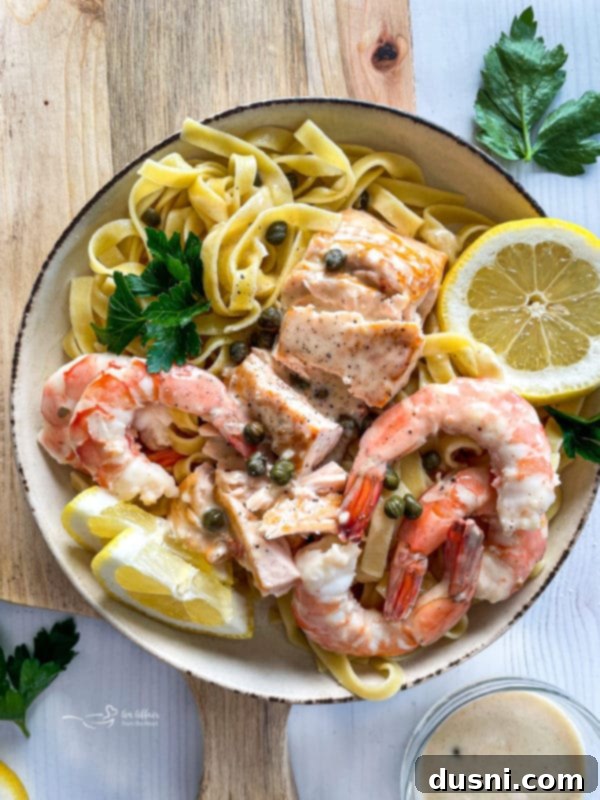 top view of lemon caper sauce with salmon and shrimp