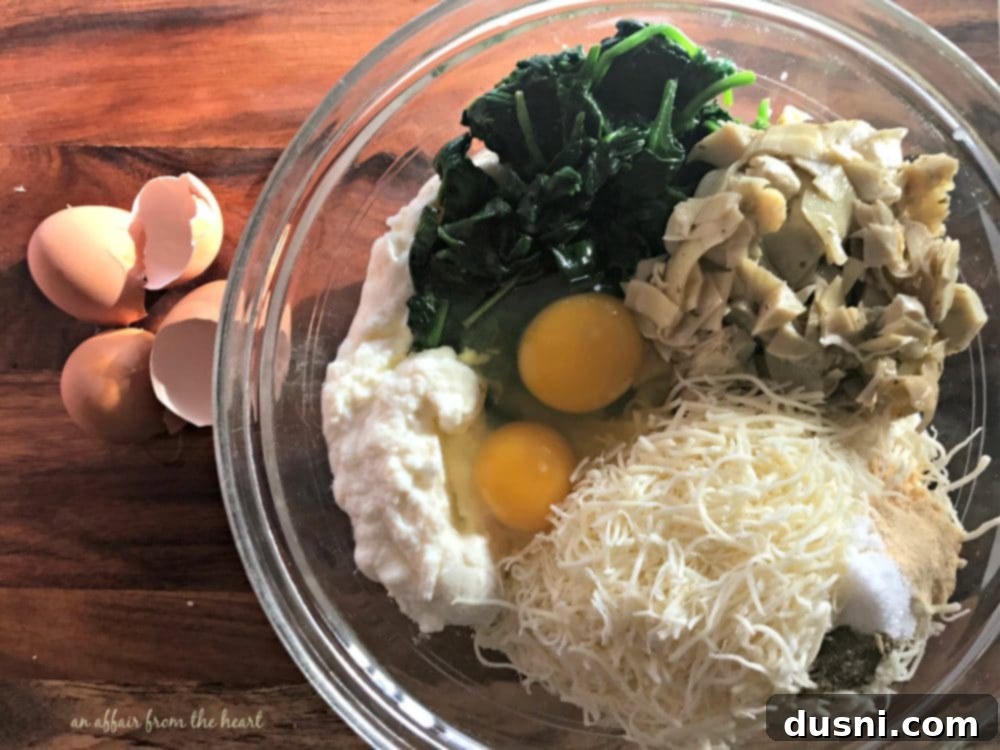 Spinach & Artichoke Stuffed Shells - Mixing the cheese and spinach filling.