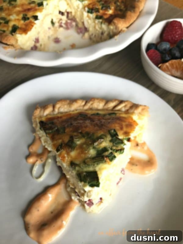 Deli-Inspired Reuben Quiche 2 Reuben Quiche with a slice taken out, served with dressing