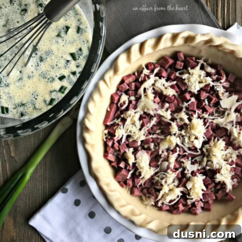 Deli-Inspired Reuben Quiche 8 Layering Swiss cheese, corned beef, and sauerkraut in the pie crust