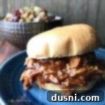 Close up of Crock Pot Dr. Pepper BBQ Pork Sandwiches