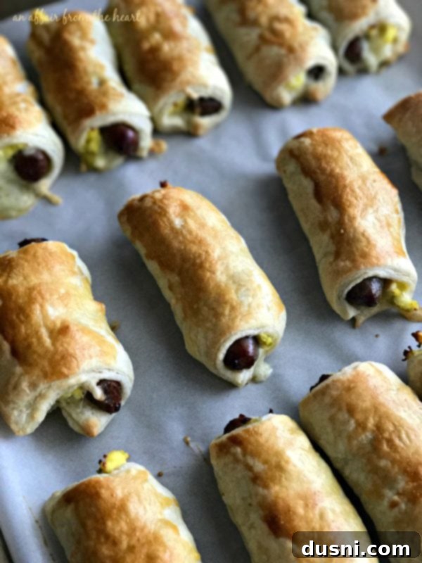 Brushing roll-ups with egg wash