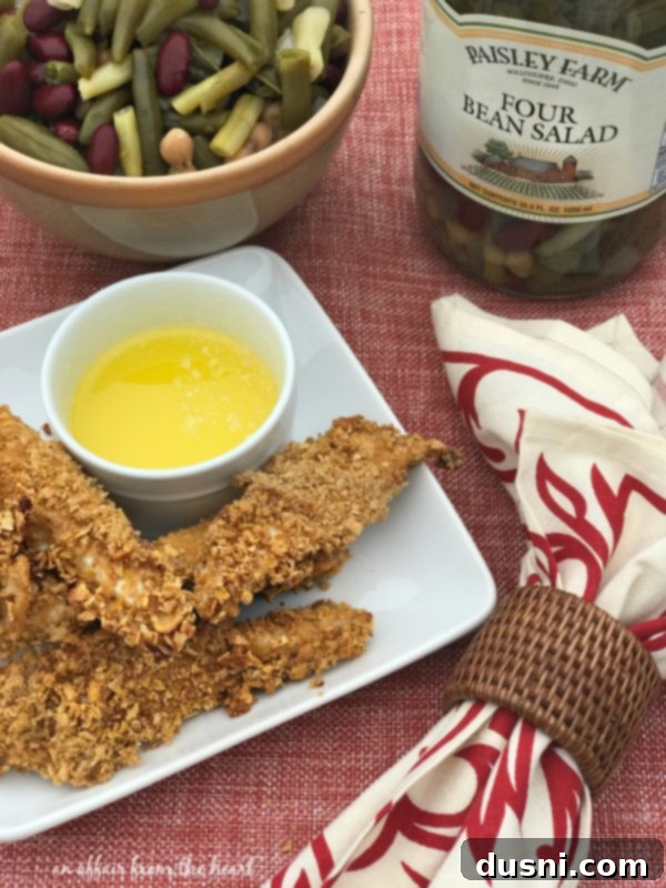 Zesty Oven-Baked Chicken Strips 9 Plate with Spicy Baked Chicken Tenders and Paisley Farm Four Bean Salad.