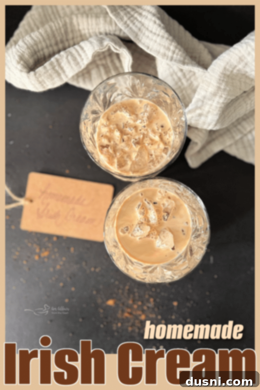 Velvet Homemade Irish Cream 6 Two glasses of homemade Irish cream on ice, garnished with chocolate shavings.