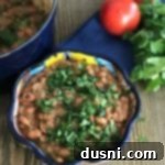 Easy Homemade Refried Beans in a festive bowl