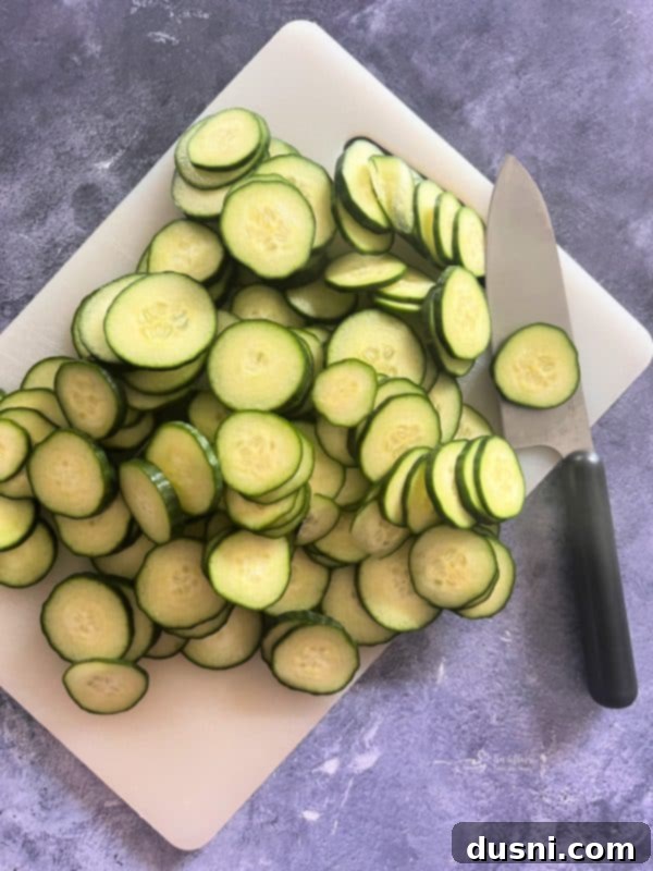 Close-up of sweet and spicy refrigerator pickles in a mason jar with sliced onions