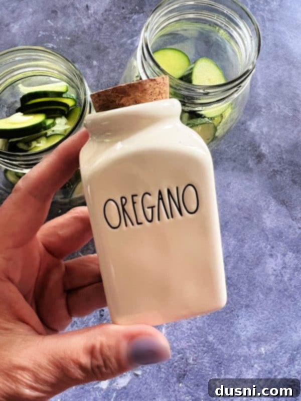 Step-by-step image of water, salt, and sugar boiling in a saucepan for pickle brine