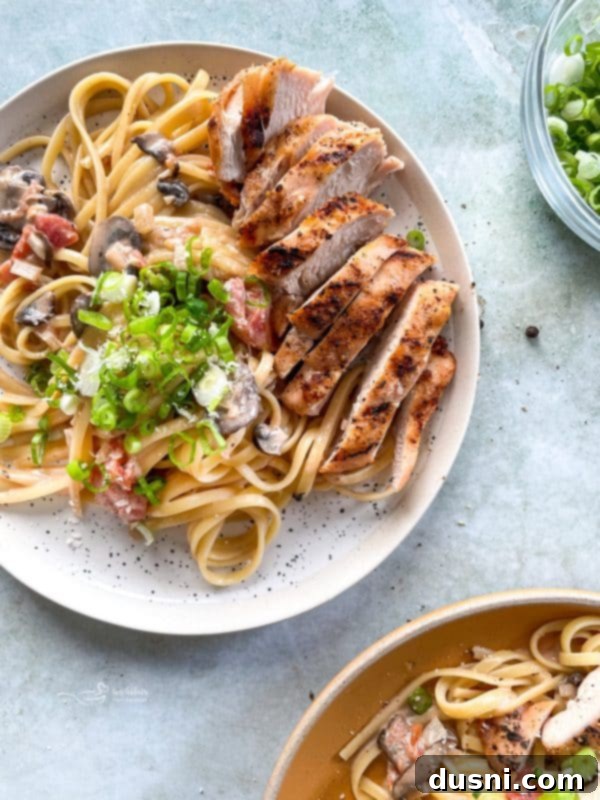 Southwest Chicken Linguine in a white bowl with cilantro garnish.