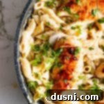 close up Creamy Chicken Penne Pasta in black skillet
