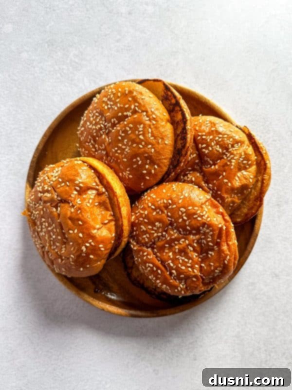Signature Mushroom Swiss Burger 13 A close-up of a Mushroom Swiss Burger with a bite taken out, showing the juicy interior.