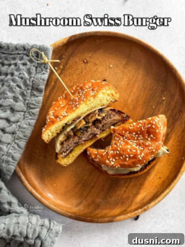 Signature Mushroom Swiss Burger 16 A beautifully presented Mushroom Swiss Burger, ready to be enjoyed.