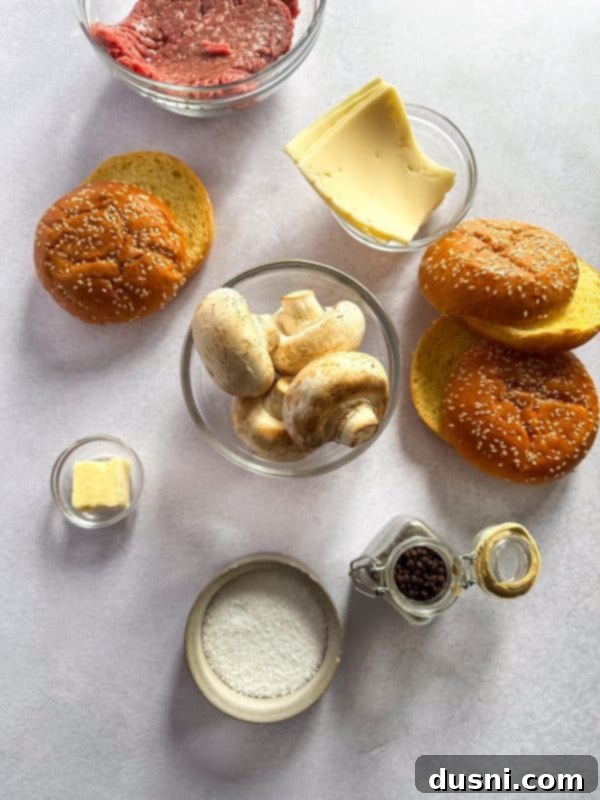 Signature Mushroom Swiss Burger 4 Two halves of a delicious Mushroom Swiss Burger, showcasing the melted cheese and juicy patty.