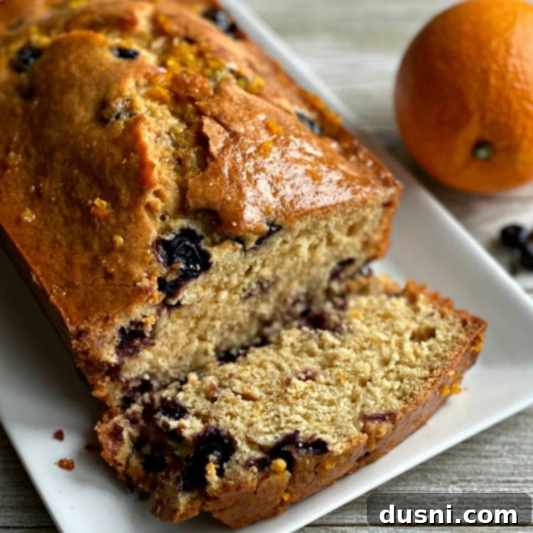 Golden Baked Blueberry Bliss 15 Blueberry Orange Bread sliced close up