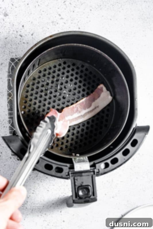 Perfectly Crispy Air Fryer Bacon 8 Air Fryer Bacon step 2: Placing bacon in a single layer