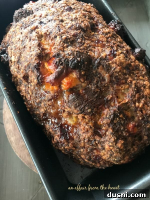 Moms Hearty Pork Sausage Meatloaf 2 Delicious Pork Sausage Meatloaf with a golden-brown crispy crust