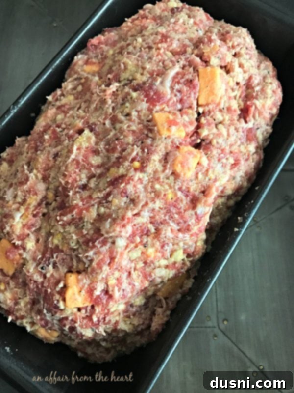 Moms Hearty Pork Sausage Meatloaf 7 Pork Sausage Meatloaf mixture formed into a loaf and placed in a greased loaf pan