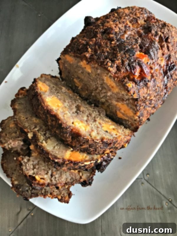 Moms Hearty Pork Sausage Meatloaf 4 Freshly baked Pork Sausage Meatloaf cooling in a loaf pan