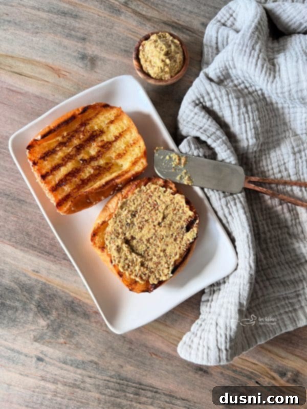 Spreading mustard on a bun