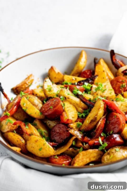 Closeup of Air Fryer Sausage and Potatoes with colorful bell peppers