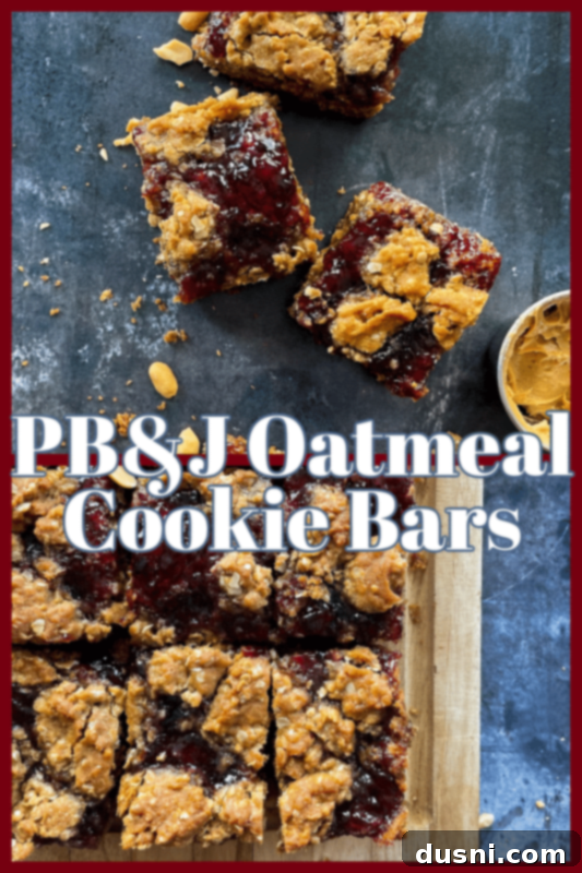 Individual PB&J Oatmeal Cookie Bars cut into squares on a cutting board