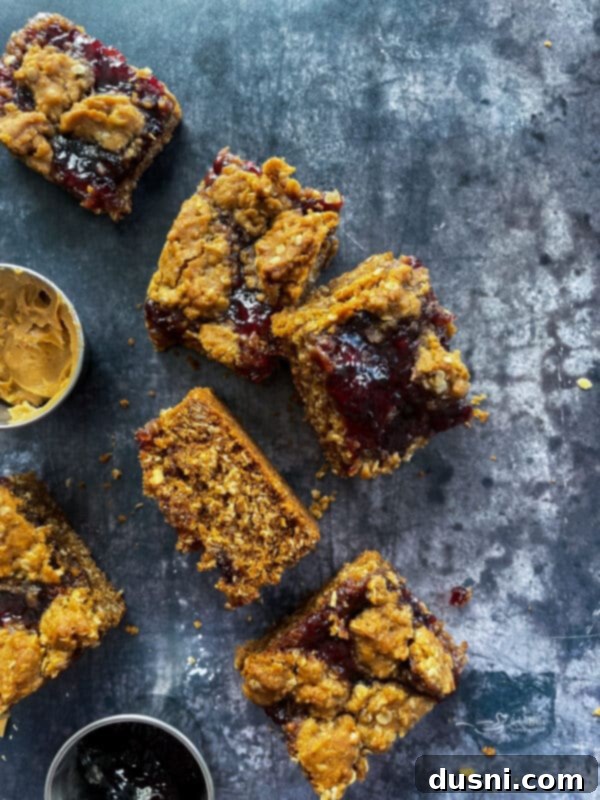 PB&J Oatmeal Cookie Bars on a cooling rack, ready to be cut