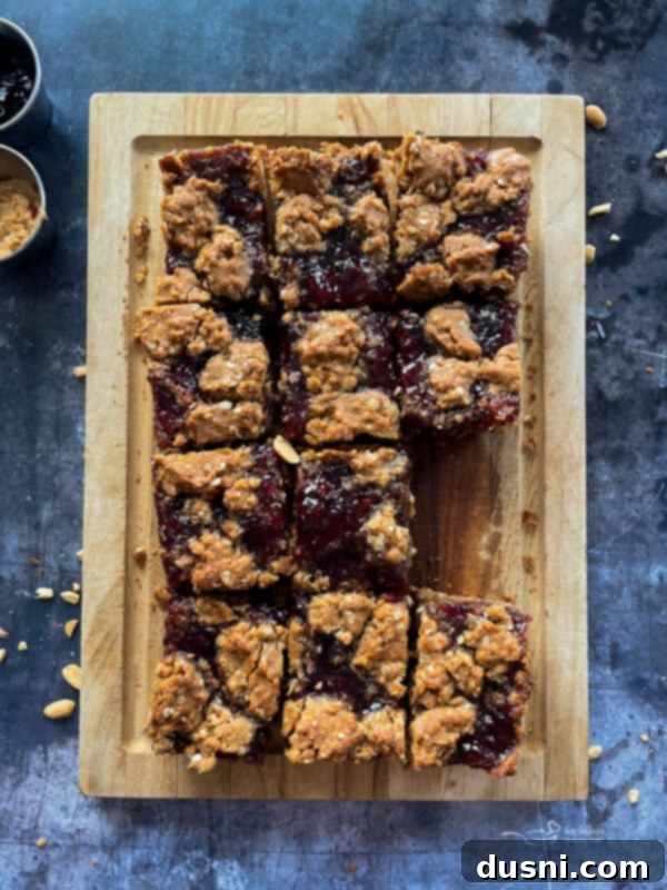 Close-up of a PB&J Oatmeal Cookie Bar on a fork, ready to be eaten