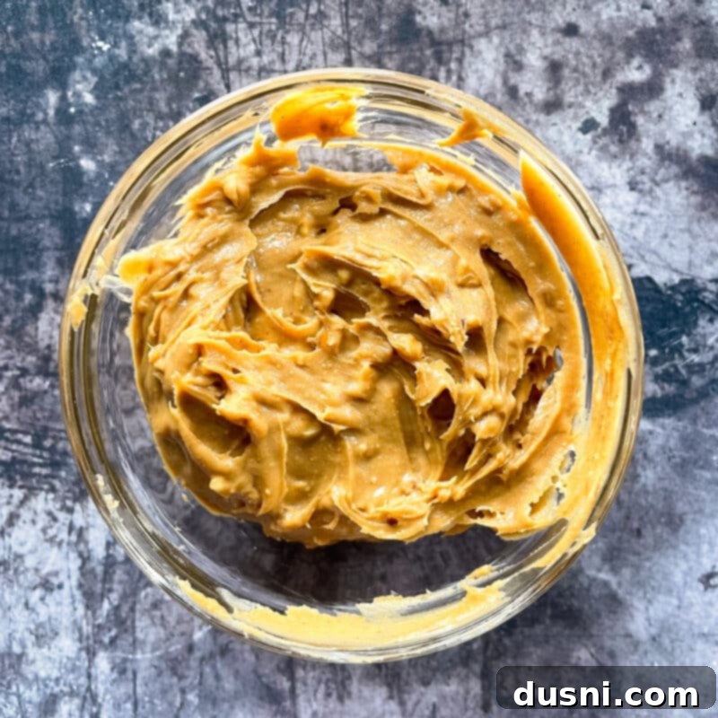 Wet ingredients for PB&J Oatmeal Cookie Bars: butter, egg, vanilla extract