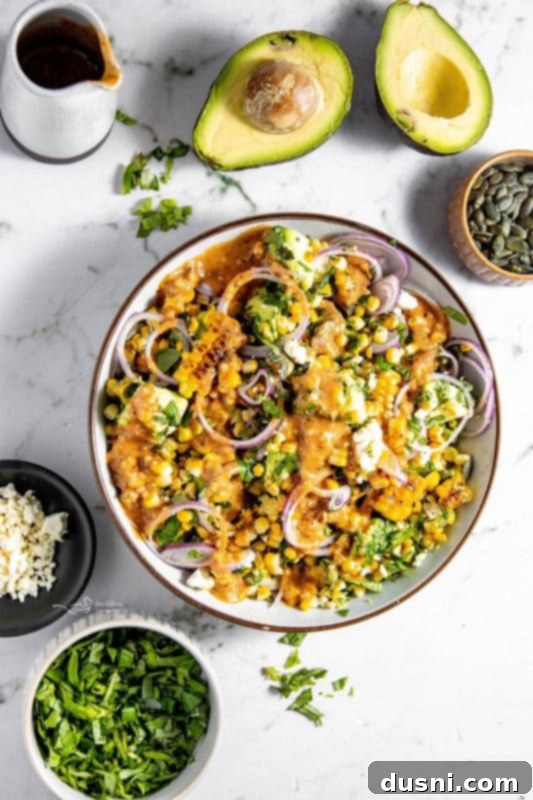 Serving suggestion of Grilled Corn and Avocado Salad, showcasing its vibrant ingredients