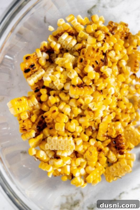 Step 2: Cutting corn kernels off the cob into a large bowl