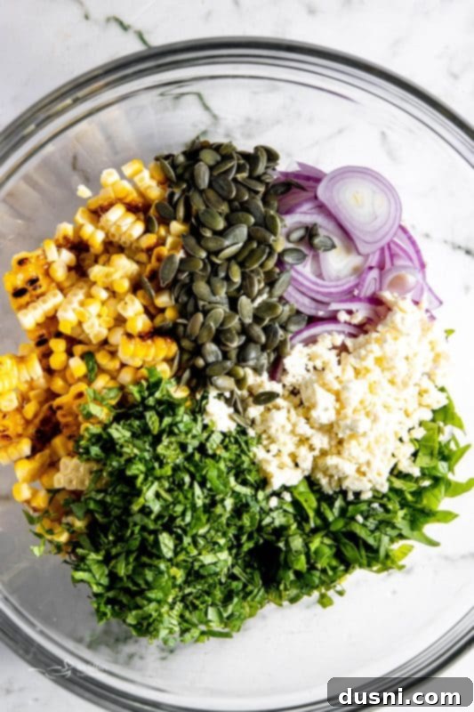 Step 3: Adding sliced red onion to the corn kernels