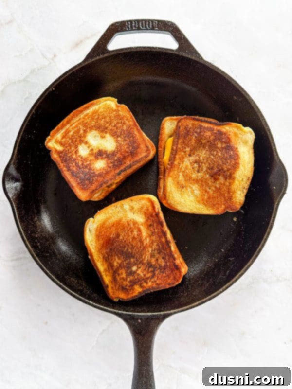 Step-by-step image of assembling the Dunker Burger with cheese, patty, and Texas Toast.