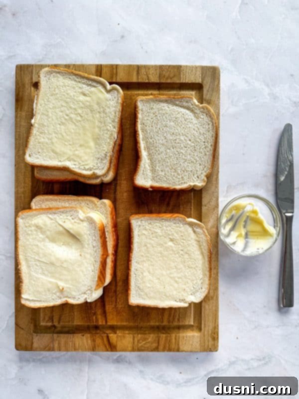 Step-by-step image of buttering Texas Toast for a Dunker Burger.