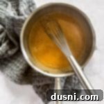 Whisking the ingredients in a pot.