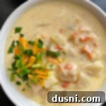 Top view of potato soup in white bowl