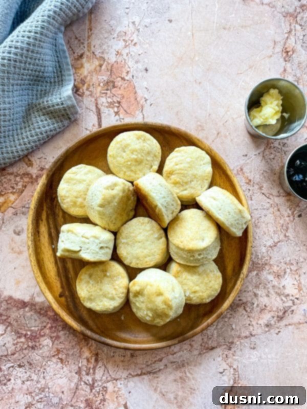Golden Buttermilk Clouds 14 A basket of freshly baked buttermilk biscuits, some split open with butter