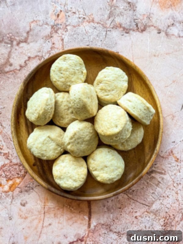 Golden Buttermilk Clouds 16 Close-up of golden brown biscuits baked on a baking sheet