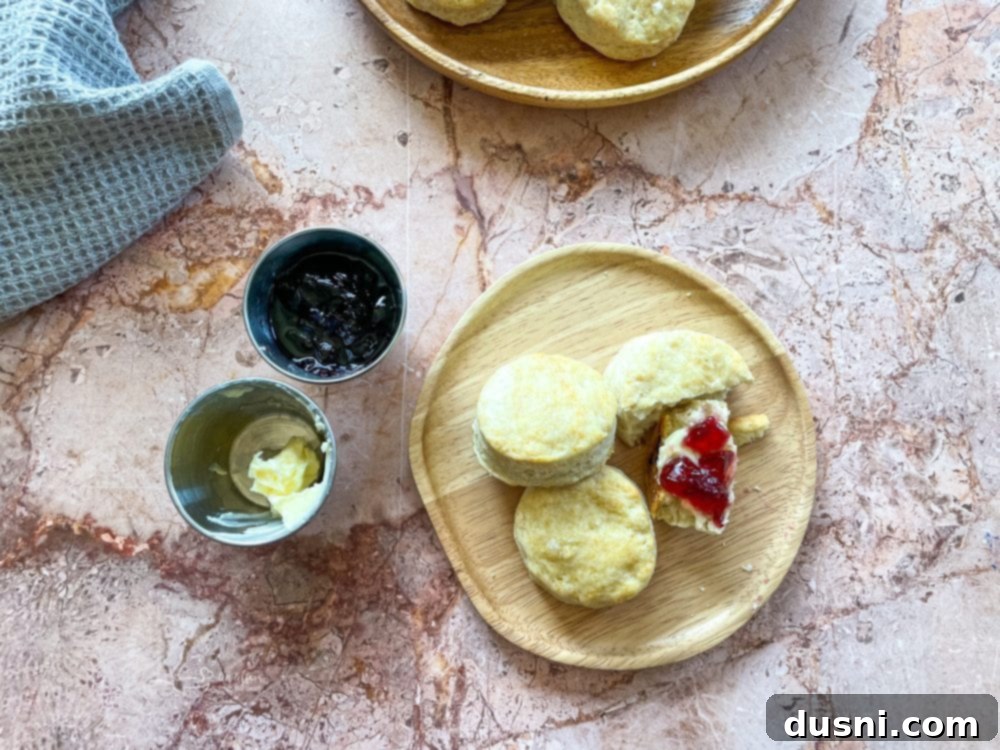 Golden Buttermilk Clouds 3 A close-up of fluffy buttermilk biscuits cooling on a wire rack