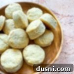 Golden Buttermilk Clouds 19 Close up of Biscuits in a brown serving bowl