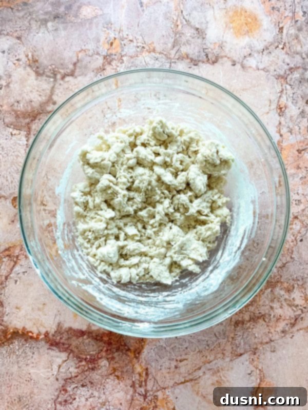 Golden Buttermilk Clouds 7 Shortening being cut into flour mixture with a pastry blender