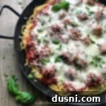 close up of Baked Spaghetti and Meatballs in a pan