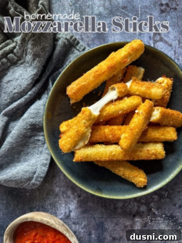 Hero shot of homemade mozzarella sticks, perfectly golden and inviting.