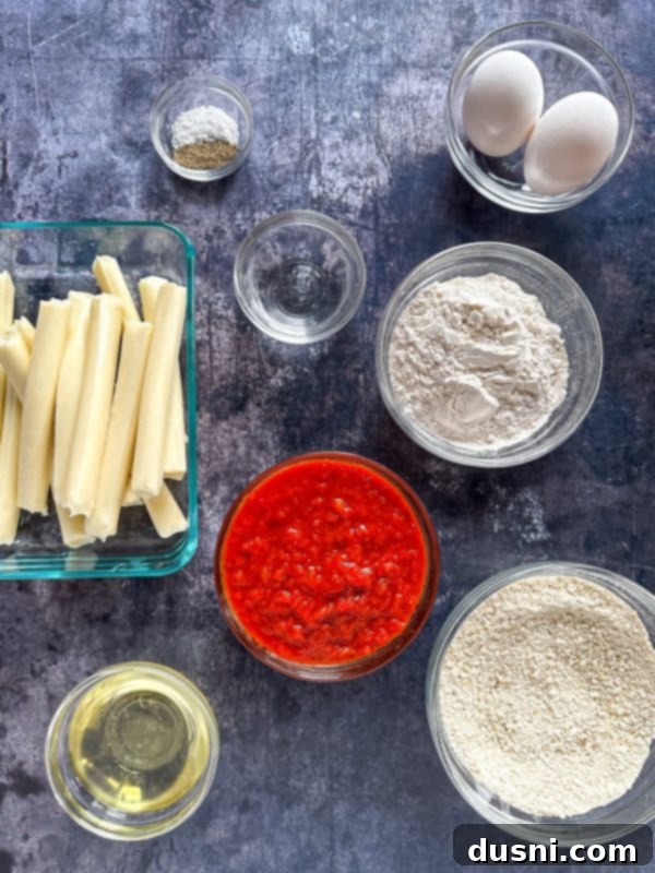 Another image of a plate of homemade mozzarella sticks, perfectly golden and inviting.