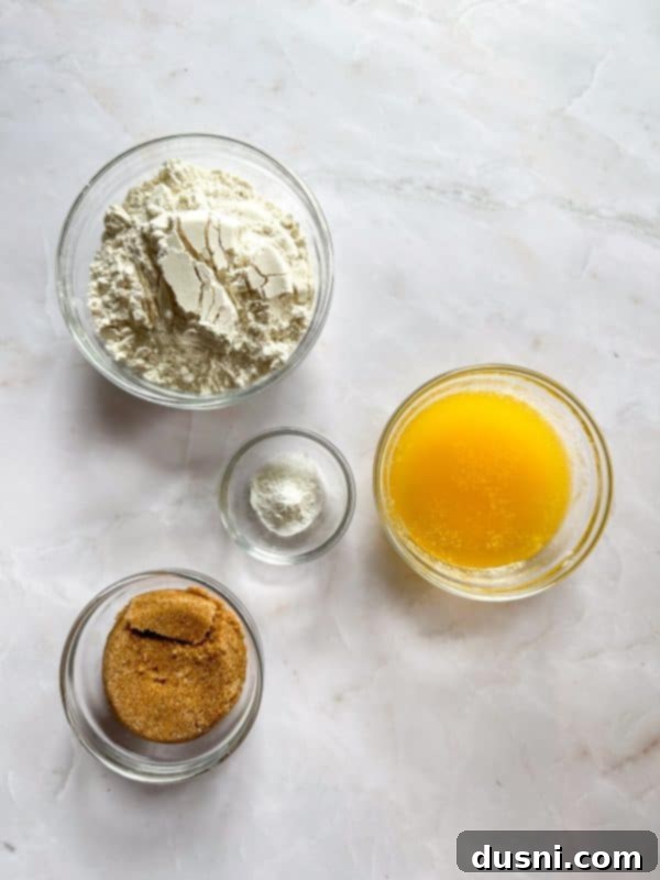 Several Apple Pie Crumb Bars neatly arranged on a white serving dish, garnished with a sprinkle of cinnamon
