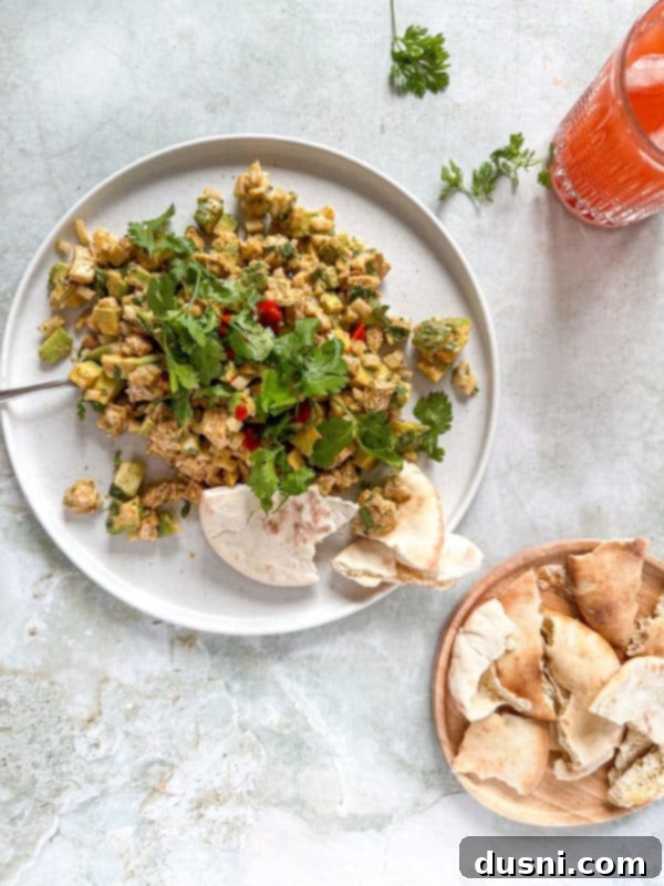 Irresistible Avocado Chicken Salad Dip 13 Avocado Chicken Salad Dip served on a small plate with crackers.