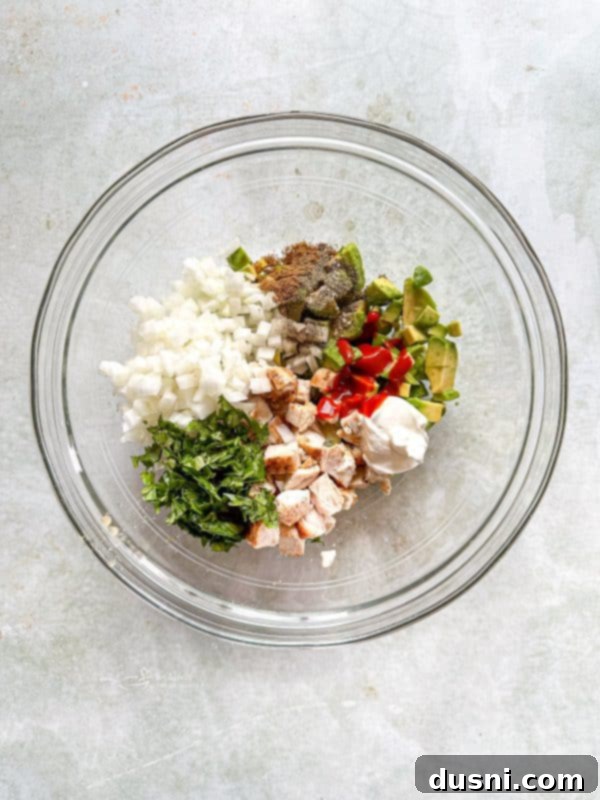 Irresistible Avocado Chicken Salad Dip 8 All ingredients for the dip are added to a large mixing bowl.