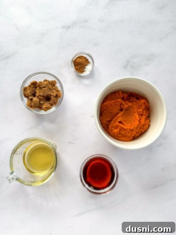 Close-up of smooth, thick pumpkin butter in a jar, showcasing its inviting texture.
