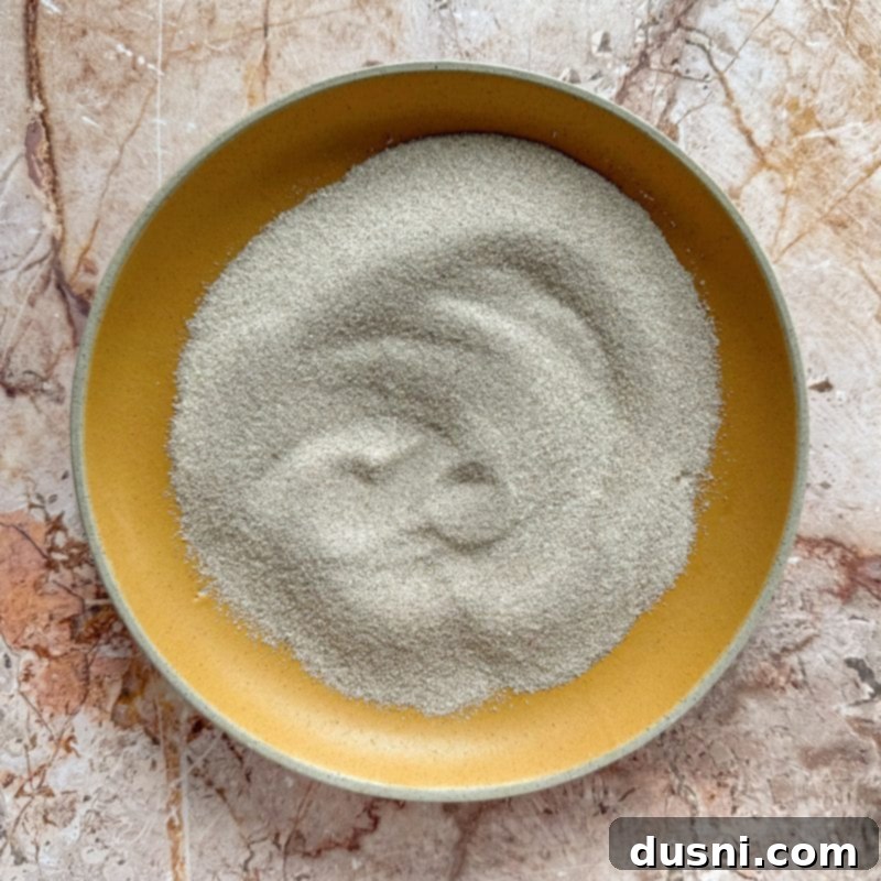 Cookie dough chilling in a bowl in the refrigerator.